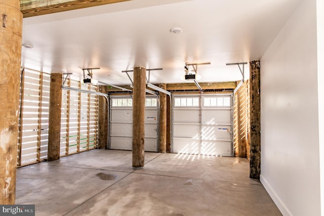 31447 Watershed Ln Unit 2, Bethany Beach, DE 19930 - garage with a garage door opener and baseboards