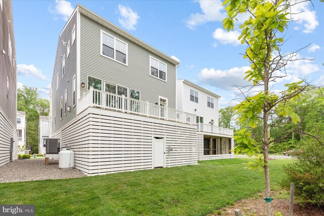 31447 Watershed Ln Unit 2, Bethany Beach, DE 19930 - back of property featuring a lawn and central air condition unit