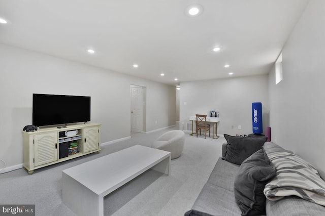 living area with light carpet, recessed lighting, and baseboards