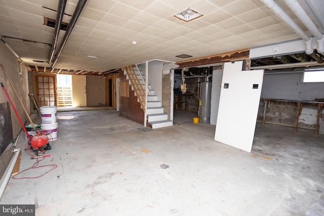 below grade area with stairway and water heater