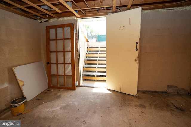 misc room featuring concrete block wall