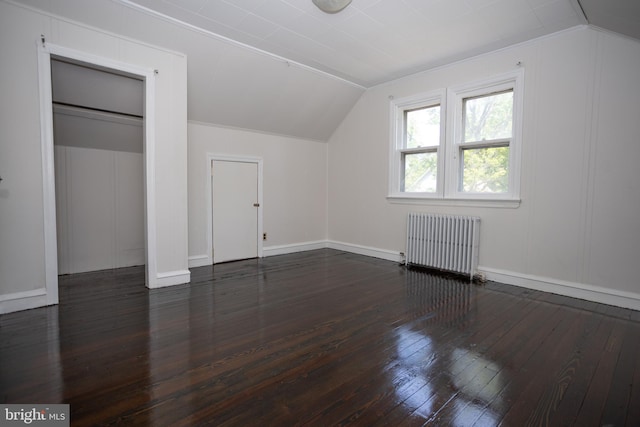 bonus room featuring radiator, lofted ceiling, wood-type flooring, and baseboards