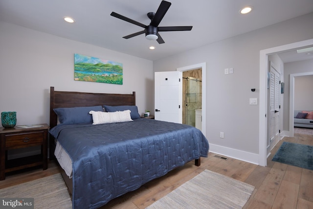 bedroom with wood finished floors, baseboards, recessed lighting, connected bathroom, and a ceiling fan