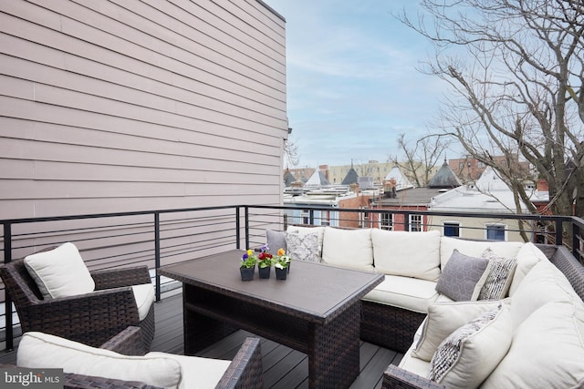 deck featuring an outdoor living space and a residential view