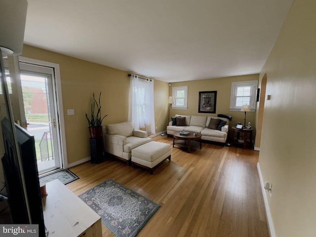 living room with wood finished floors and baseboards