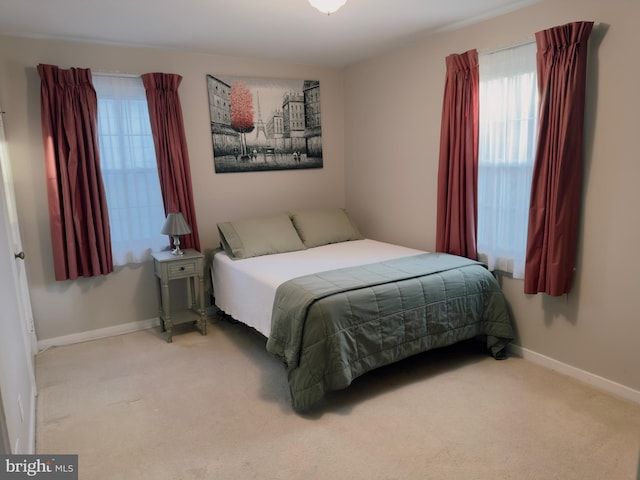 bedroom featuring carpet floors and baseboards