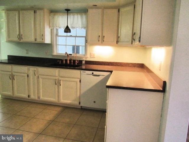 145 Phillips Ln, Bunker Hill, WV 25413 - kitchen featuring dishwasher, a sink, light tile patterned flooring, and pendant lighting