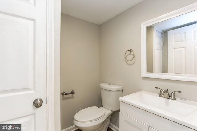 5415 Cynthia Ter, Baltimore, MD 21206 - half bath featuring toilet, baseboards, and vanity