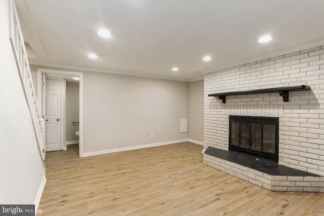 5415 Cynthia Ter, Baltimore, MD 21206 - unfurnished living room featuring baseboards, ornamental molding, wood finished floors, recessed lighting, and a brick fireplace