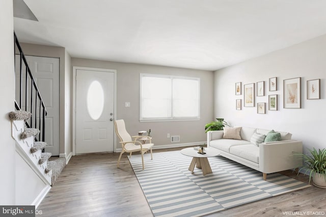 5415 Cynthia Ter, Baltimore, MD 21206 - living area featuring wood finished floors, stairs, and baseboards