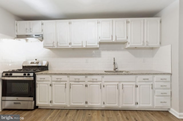 5415 Cynthia Ter, Baltimore, MD 21206 - kitchen featuring stainless steel gas range, a sink, under cabinet range hood, and white cabinetry