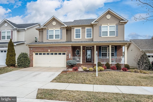 734 Holden Rd, Frederick, MD 21701 - traditional-style home with a porch, brick siding, an attached garage, concrete driveway, and a front yard