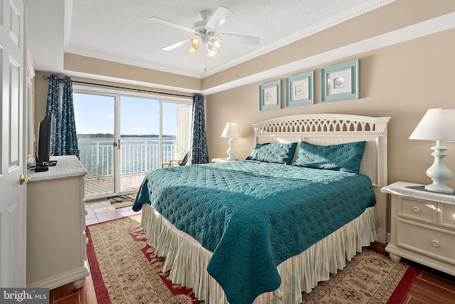 bedroom with access to exterior, a textured ceiling, ornamental molding, wood finished floors, and ceiling fan