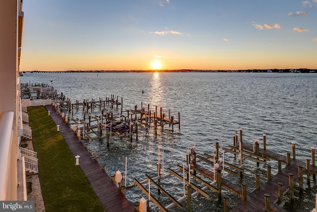 dock area with a water view and boat lift
