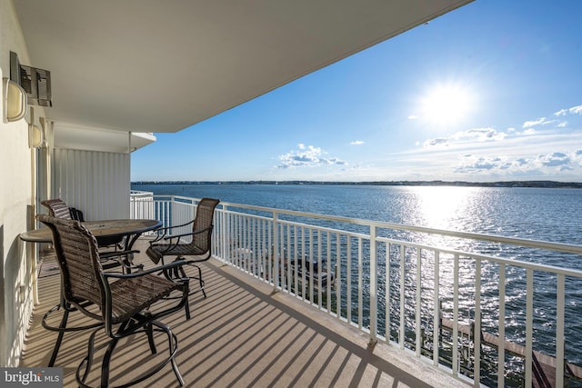 balcony featuring a water view