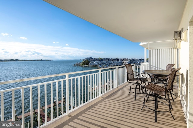 balcony featuring a water view