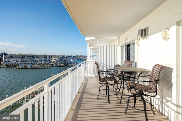 balcony featuring a water view