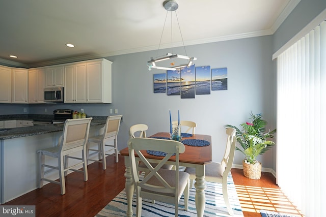 35427 Mercury Dr Unit 47B, Rehoboth Beach, DE 19971 - dining room with wood finished floors, ornamental molding, recessed lighting, and baseboards