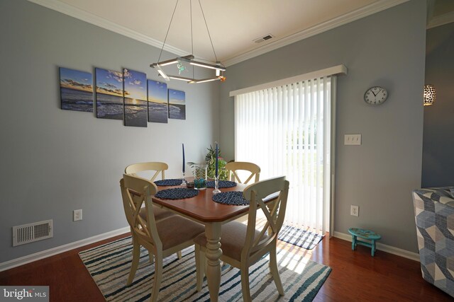 35427 Mercury Dr Unit 47B, Rehoboth Beach, DE 19971 - dining room featuring wood finished floors, baseboards, and ornamental molding