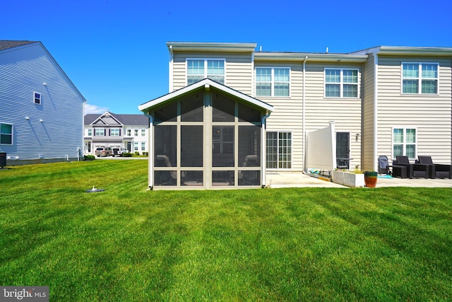 35427 Mercury Dr Unit 47B, Rehoboth Beach, DE 19971 - back of house featuring a patio area, a yard, and a sunroom