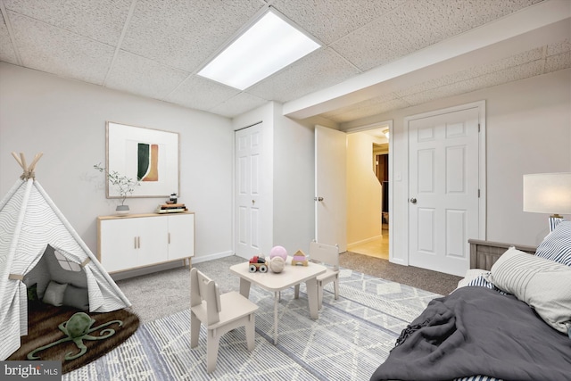 1279 Elm Grove Cir, Silver Spring, MD 20905 - carpeted living area with a drop ceiling and baseboards