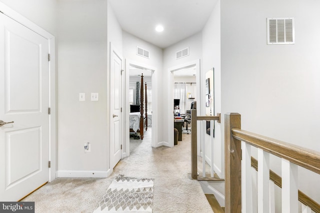 2660 Richmond Way, Hanover, MD 21076 - hallway with baseboards, light colored carpet, and an upstairs landing