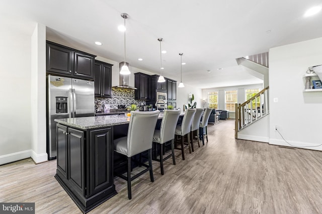 2660 Richmond Way, Hanover, MD 21076 - kitchen featuring stainless steel fridge, a large island, light wood-style flooring, wall chimney range hood, and recessed lighting