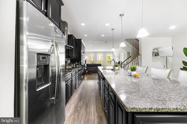 2660 Richmond Way, Hanover, MD 21076 - kitchen with stainless steel fridge, dark cabinetry, wood finished floors, a sink, and recessed lighting
