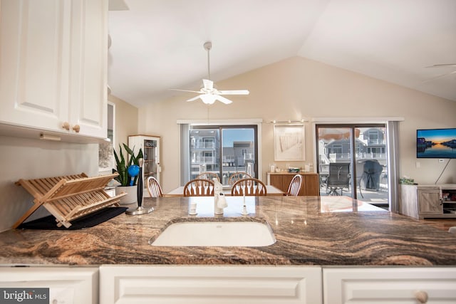 28 Diane Rd, Manahawkin, NJ 08050 - kitchen featuring a ceiling fan, white cabinets, vaulted ceiling, dark stone countertops, and healthy amount of natural light