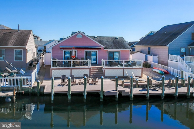 28 Diane Rd, Manahawkin, NJ 08050 - back of house with a deck with water view, a fenced backyard, and stairway