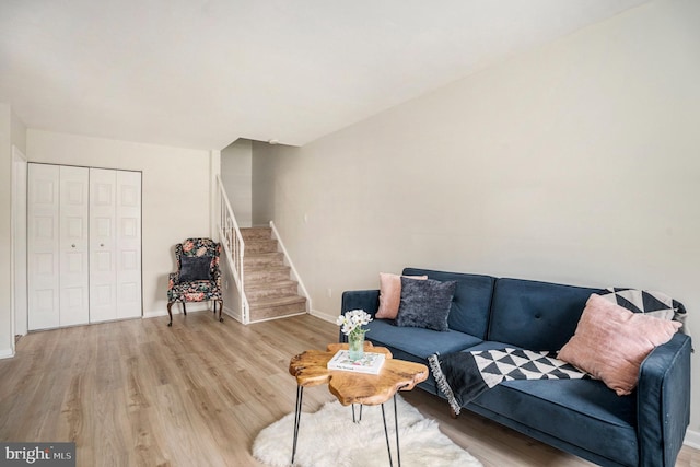 7015 Ridge Ave Unit 19, Philadelphia, PA 19128 - living room featuring wood finished floors, stairs, and baseboards
