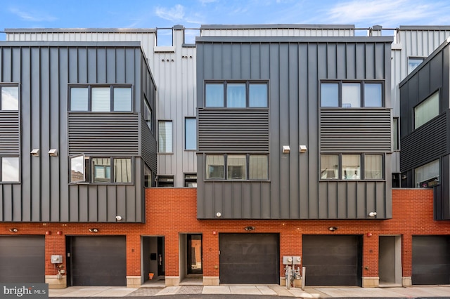 307 Reed St Unit C, Philadelphia, PA 19147 - view of building exterior featuring a garage