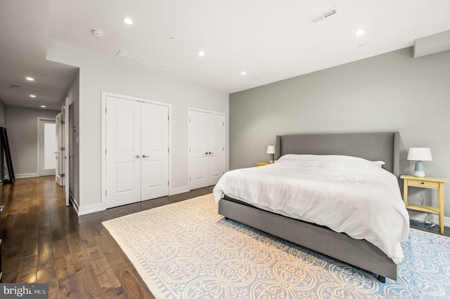307 Reed St Unit C, Philadelphia, PA 19147 - bedroom featuring two closets, wood-type flooring, recessed lighting, and baseboards