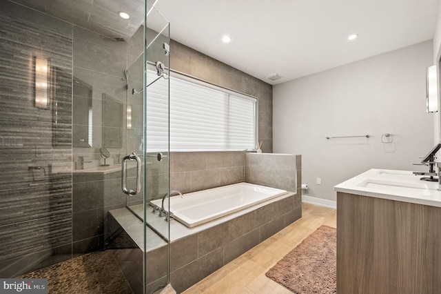 307 Reed St Unit C, Philadelphia, PA 19147 - full bathroom featuring a shower stall, a bath, recessed lighting, baseboards, and vanity
