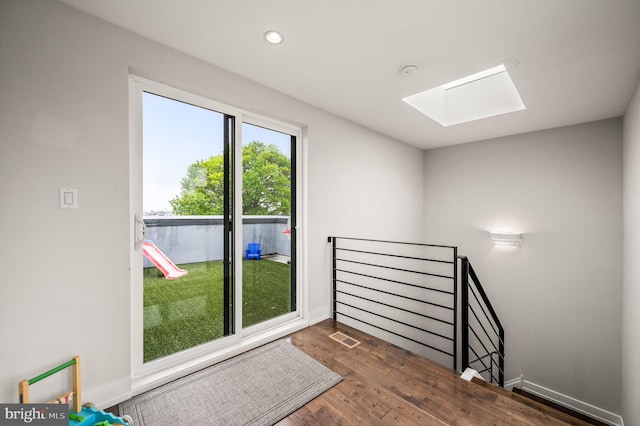 307 Reed St Unit C, Philadelphia, PA 19147 - doorway featuring a skylight, wood finished floors, recessed lighting, and baseboards