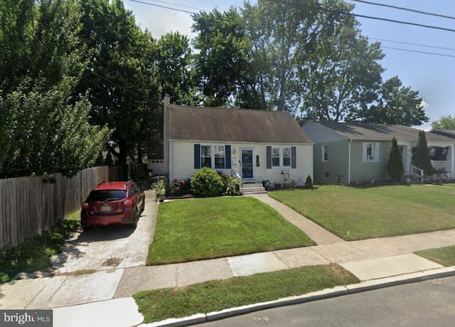 view of front facade featuring concrete driveway and a chimney