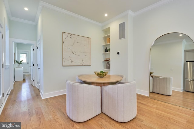 309 M St NW Unit B, Washington, DC 20001 - dining area with light wood-style flooring, ornamental molding, arched walkways, baseboards, and recessed lighting