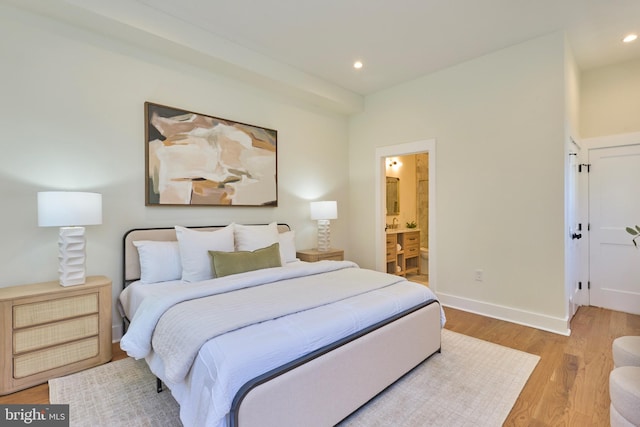 309 M St NW Unit B, Washington, DC 20001 - bedroom featuring light wood-style floors, recessed lighting, baseboards, and connected bathroom
