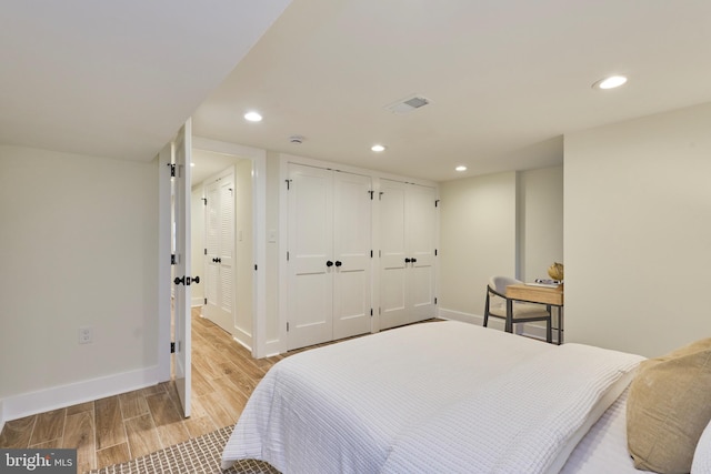 309 M St NW Unit B, Washington, DC 20001 - bedroom with light wood-style floors, recessed lighting, baseboards, and multiple closets