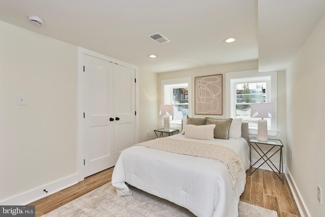 309 M St NW Unit B, Washington, DC 20001 - bedroom with light wood-style floors, a closet, baseboards, and recessed lighting