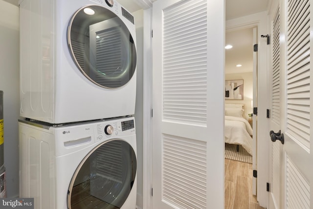 309 M St NW Unit B, Washington, DC 20001 - washroom featuring stacked washer and clothes dryer, wood finished floors, and recessed lighting