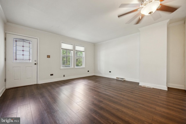 foyer featuring dark wood-style flooring, baseboards, ornamental molding, and a ceiling fan