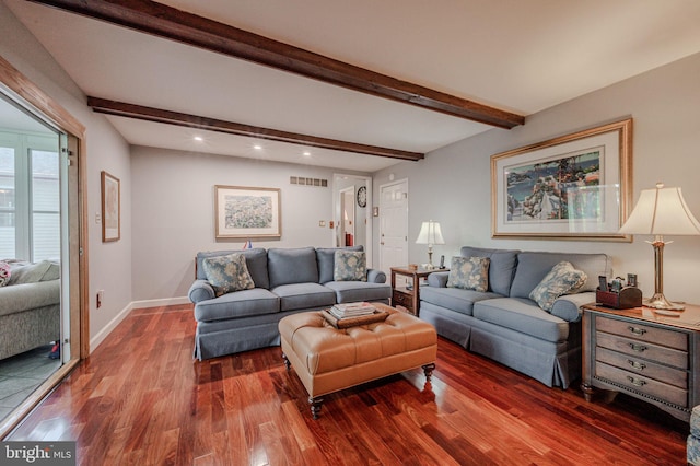 living area with wood finished floors, beamed ceiling, recessed lighting, and baseboards