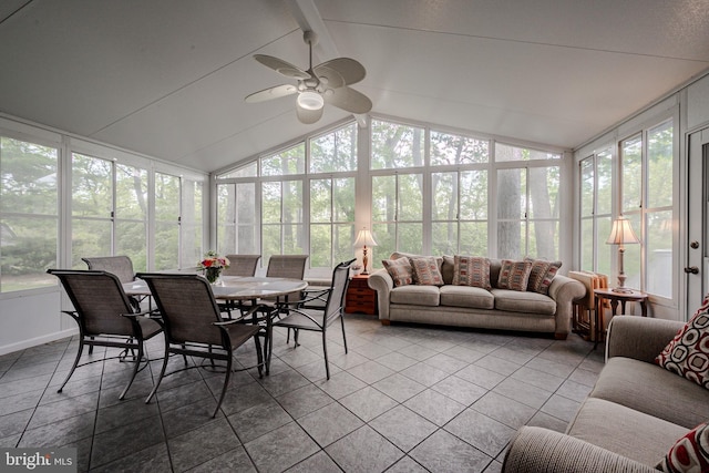 sunroom with a ceiling fan, healthy amount of natural light, and tile patterned floors