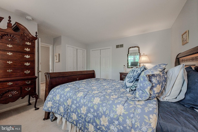 bedroom featuring light carpet