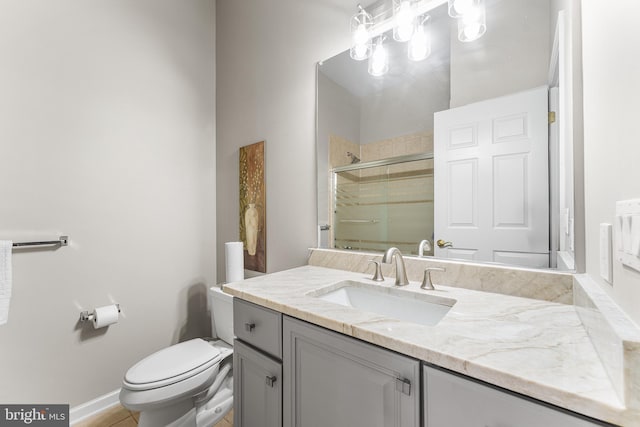 full bath featuring a shower stall, toilet, and vanity