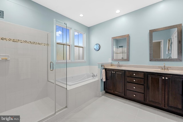 23325 April Mist Pl, Brambleton, VA 20148 - full bathroom with a garden tub, a shower stall, double vanity, and tile patterned flooring