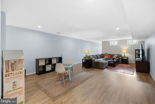 23325 April Mist Pl, Brambleton, VA 20148 - living room featuring wood finished floors, recessed lighting, and baseboards
