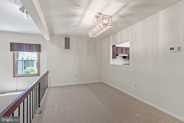 11543 Summer Oak Dr, Germantown, MD 20874 - empty room with light colored carpet, baseboards, and a chandelier