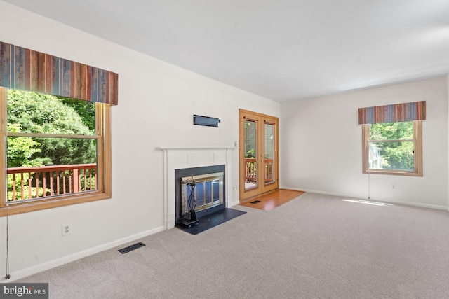 11543 Summer Oak Dr, Germantown, MD 20874 - unfurnished living room with carpet flooring, a fireplace with flush hearth, and baseboards